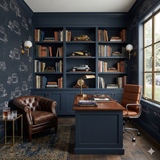 Aurelio Motor Archive Wallpaper featuring vintage car blueprint pattern, displayed on a dark blue accent wall.
