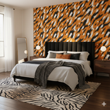 Bengara Flame wallpaper with an orange, black, and white animal print pattern covering a bedroom wall.