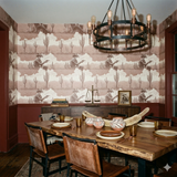 Sepia outlaw vista wallpaper with a cowboy and cactus pattern, decorating a dining room with furniture and accessories.