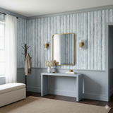 Blue and white tree-patterned wallpaper with vertical design and neutral accents.