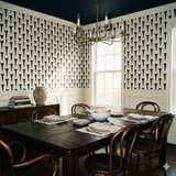 Patterned wallpaper by York Wallcoverings with nail design, covering dining room walls above the white wainscoting.