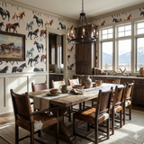 Painted herd wallpaper with horse motifs covering the walls in a dining room.