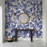 Blue mosaic wallpaper by Brewster Home Fashions featuring fragmented patterns in an interior hallway.
