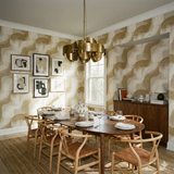 Golden Driftmark Wallpaper with wavy patterns on the walls.