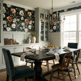 Floral print wallpaper with a dark background, featuring peach and white blooms.