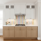 Pastel Promenade Wallpaper with colorful vertical stripes, shown installed as a kitchen backsplash.
