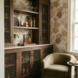 Botanical wallpaper with canopy pattern, featuring shades of brown and beige.
