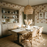 Palladium Blush wallpaper with floral pattern against a neutral backdrop, complemented by white wainscoting and framed botanical art.