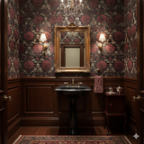 Red monastery wallpaper with floral damask pattern and ornate gold framed mirror.
