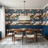 Condor's Rest wallpaper featuring birds and mountain patterns, with blue paneled wainscoting and brass chandelier.
