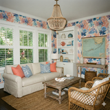 Saltwater Almanac Wallpaper with coral and sea patterns filling a coastal style living room.
