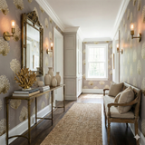 Grey and gold reefburst wallpaper with a floral-like pattern, set in an elegant hallway.