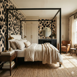 Raw Aperture wallpaper with a black and beige animal print pattern, covering the bedroom walls.
