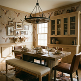 Cattleman's Creed wallpaper, with a repeating pattern of cattle skulls and vintage cowboy art, covering a dining room wall.
