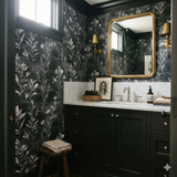 Botanique wallpaper in black and white Havenshade pattern, with a stylized floral design in a bathroom setting.