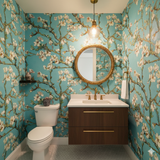 Skyward Blossoms Wallpaper with floral pattern, almond blossom tree branches, and blue background.