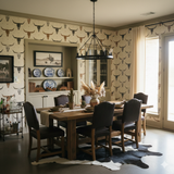 Cattletrail Constellation Wallpaper with bull skull pattern, seen in a stylishly decorated dining room.