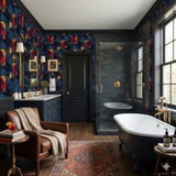 Evening Apertivo wallpaper with a cocktail glass and lemon pattern, covering the walls of a modern bathroom.