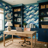 Deepwater Waltz Wallpaper with wave pattern, in a palette of blues and creams, on an accent wall.
