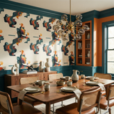 Inner Currents Wallpaper with face silhouettes, by Candice Olson, on a dining room wall above a sideboard.
