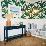 St. Aurelia Grove wallpaper by Brewster, featuring a tropical banana leaf pattern on a white background.
