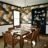 Abstract patterned wallpaper with gold accents, styled in a dining room with black trim.
