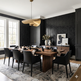 Black Obsidian Patent Wallpaper with reptile texture, covering an elegant dining room.