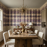 Mauve and tan plaid wallpaper with textured pattern, styled in a dining room.
