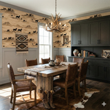 Desert landscape wallpaper with running horses, alongside rustic wood dining set and cowhide rug.
