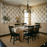 Folia Noir Wallpaper with a black floral pattern on a light background.