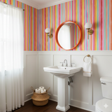 Colorful striped Prism Parade Wallpaper with watercolor-inspired details.
