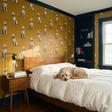 Dog-printed wallpaper in mustard yellow with a repeating dog pattern.
