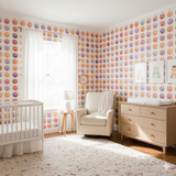 Colorful polka dot pattern wallpaper in a nursery.