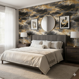Stormborne wallpaper with black and gold pattern, styled on a bedroom accent wall behind a bed.