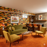 Retro patterned wallpaper with orange, green, and brown swirling design.