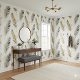 Plume Aureate Wallpaper with golden and gray feathers, styled in a modern room.
