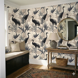 Neutral wallpaper with a crane and palm leaf pattern, styled in an entryway.