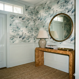 Crane pattern Fogbend Canopy Wallpaper with bamboo details on wall behind entryway table.