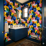 Floral wallpaper with yellow, blue, and pink flowers and green leaves.