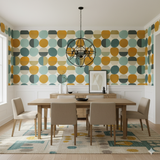 Solenne Wallpaper with a geometric circle pattern, against a white paneled dining room wall.
