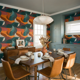 Colorful Rye Current Wallpaper with a wave pattern, brand not provided, displayed in a dining room setting.