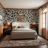 Freemont Hide Wallpaper with a spotted pattern on the bedroom wall.