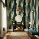 Green Cypressoire wallpaper from Brewster Wallcovering featuring a painterly forest pattern with trees and abstract shapes.
