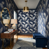 Feather pattern wallpaper with silver plumes from Nightingate, accenting a hallway with modern furnishings.
