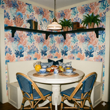 Floral wallpaper in shades of blue and coral, with a coral reef pattern.