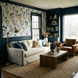 Floral Bluewind Meadow Wallpaper with blue flower pattern, over navy wainscoting in a styled living room.