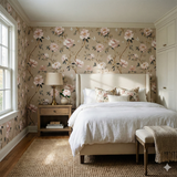 Floral bloom wallpaper with butterfly pattern, covering a bedroom wall.