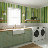 Green Verdant Lines wallpaper with a striped pattern with varying tones, showcasing a laundry room setting.