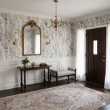 Orchidée Lune wallpaper with floral pattern, covering walls above white wainscotting.