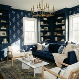 Navy sprig wallpaper with a white botanical pattern, textured design, in a styled living room.
